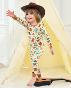 Howdy Halloween Long Two-Piece Pajama Set - child wearing the pajamas while standing with one arm raised