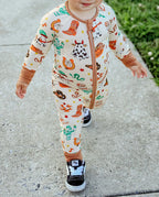 Close-up of Howdy Halloween Bamboo Zippy showing western Halloween print and two-way zipper