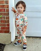 Child wearing Howdy Halloween Bamboo Zippy standing by a garage door outdoors