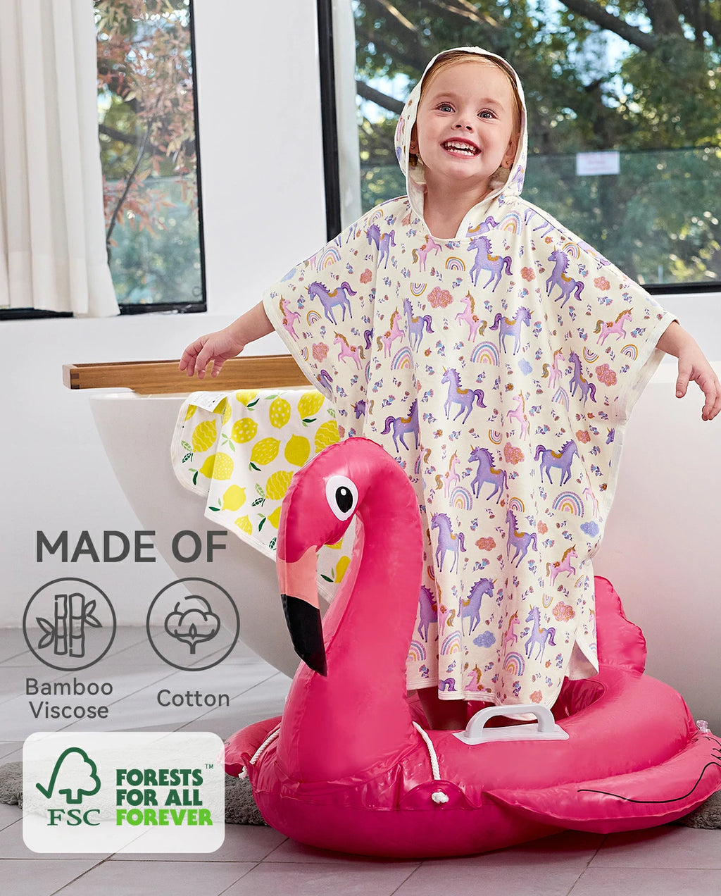 Lavender Unicorn Hooded Toddler Bath Towel - material information graphic beside a child on a flamingo pool float