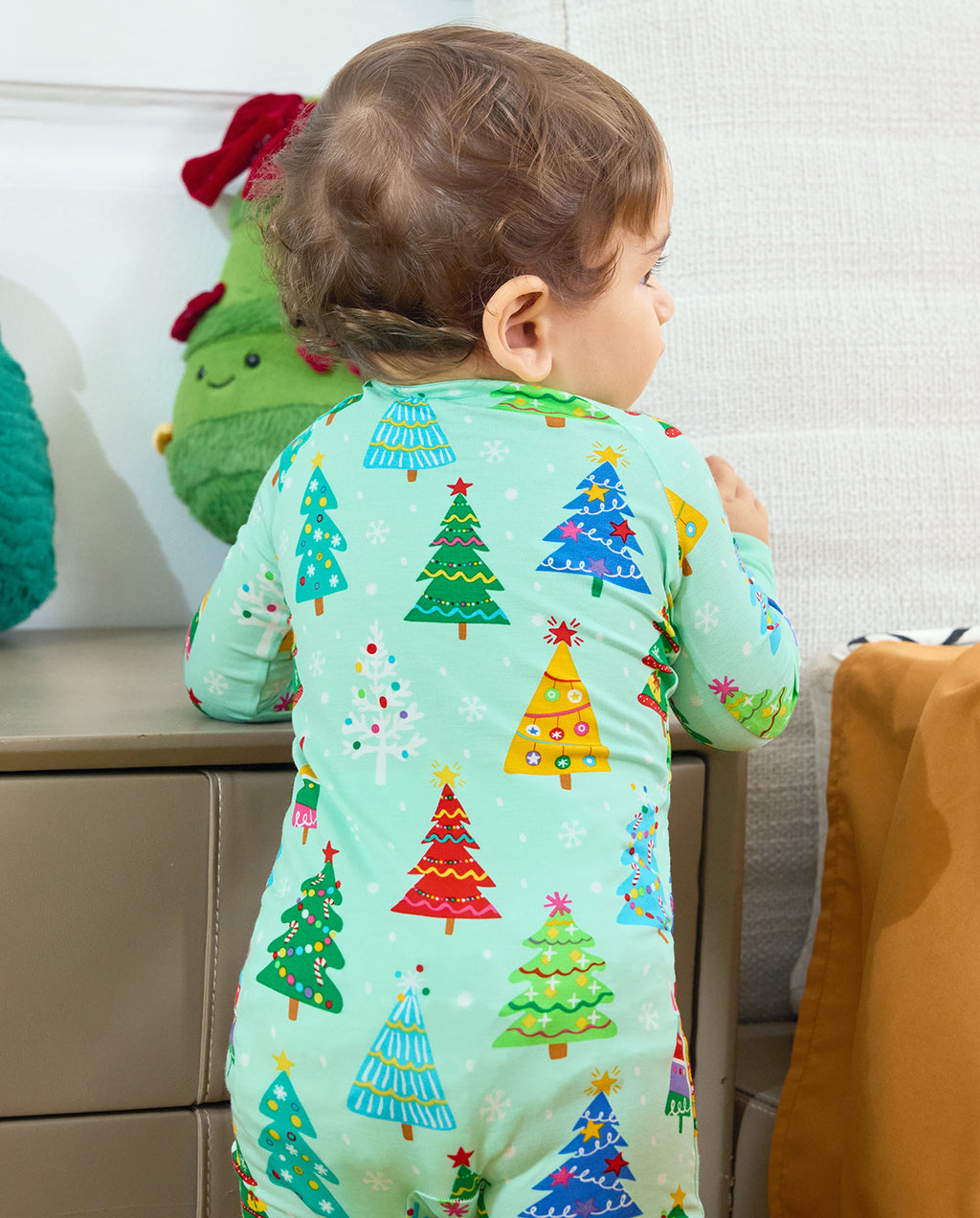 Close-up of the Merry Trees Bamboo Zippy back with colorful decorated trees and snowflakes