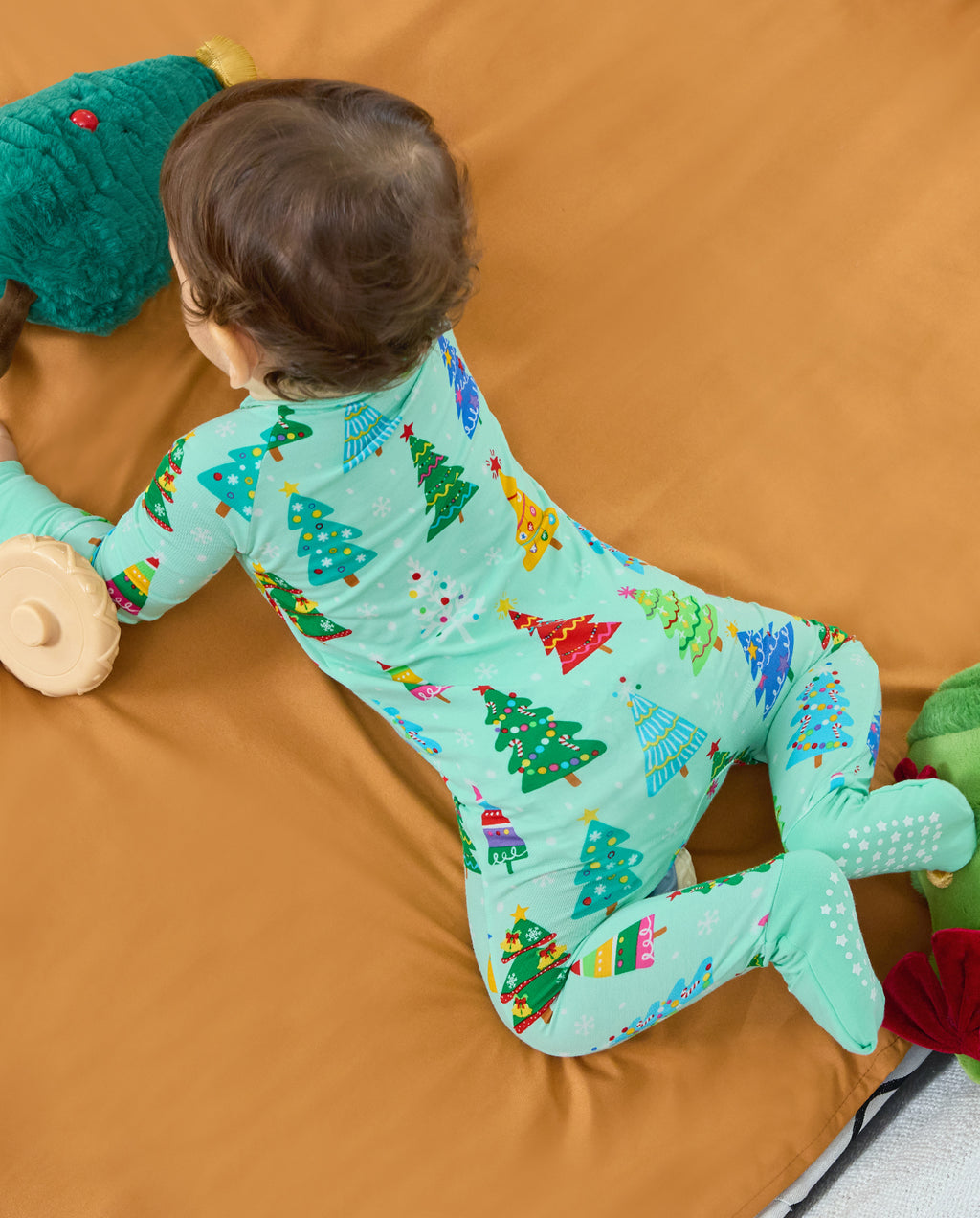 Back view of a baby crawling in the Merry Trees Bamboo Zippy with covered feet