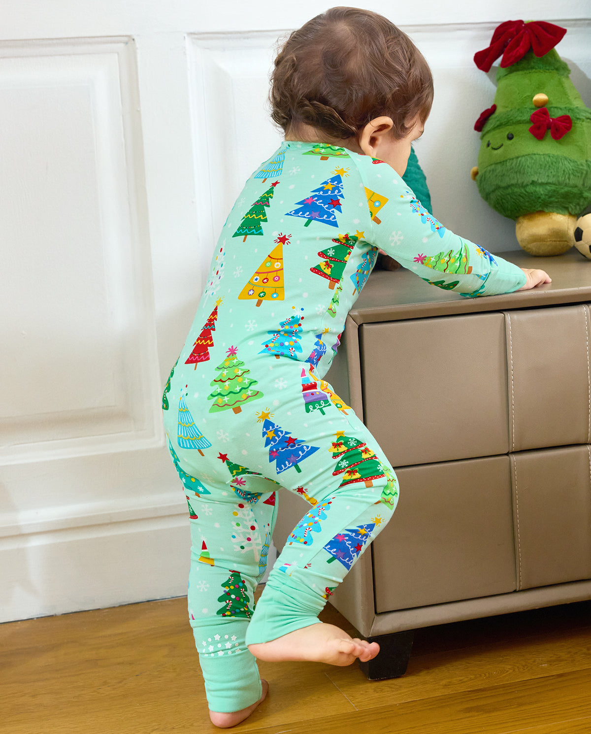 Baby standing in the Merry Trees Bamboo Zippy with one foot cuff open