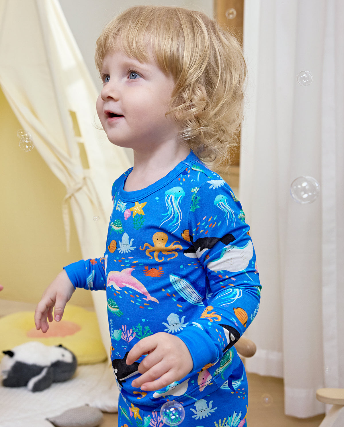 Close view of a child wearing blue Ocean Friends pajamas