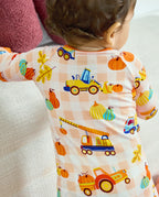 Back detail of Pumpkin Tractors Bamboo Zippy showing construction vehicles and pumpkins on a cream check background.