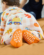 Pumpkin Tractors Bamboo Zippy showing orange foot cuffs with white grip dots.
