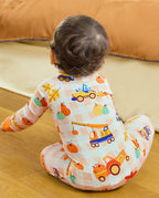 Seated back view of Pumpkin Tractors Bamboo Zippy showing the pumpkin and construction vehicle pattern.