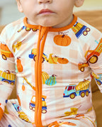 Close-up of the orange neckline and zipper on Pumpkin Tractors Bamboo Zippy.