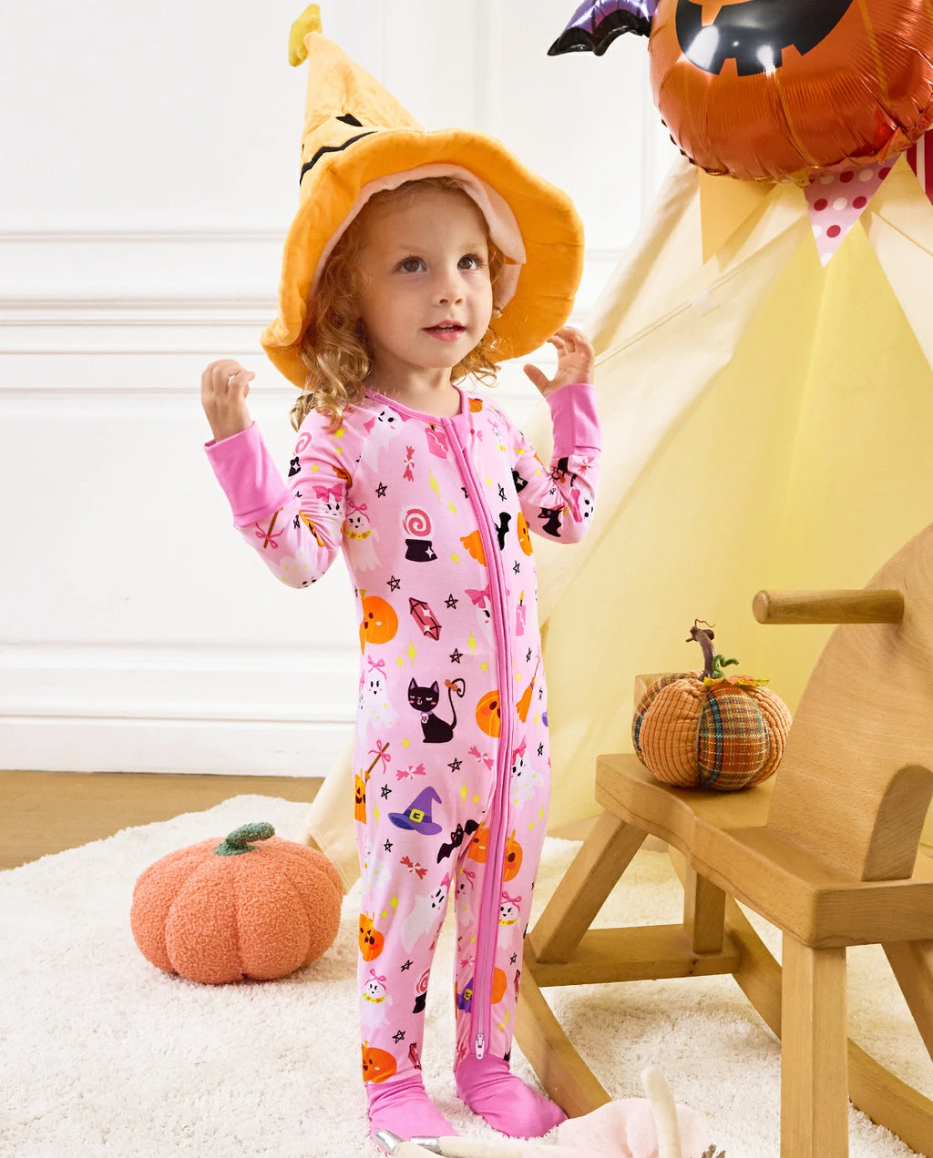 Spooky Cute Bamboo Zippy baby sleeper showing cute Halloween print details with ghosts, pumpkins, and bats