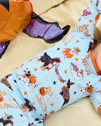 Spooky Pups Long Two-Piece Pajama Set - close-up of the puppy print while the child is seated