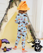 Spooky Pups Long Two-Piece Pajama Set - child wearing the pajamas in a Halloween tent scene, back view
