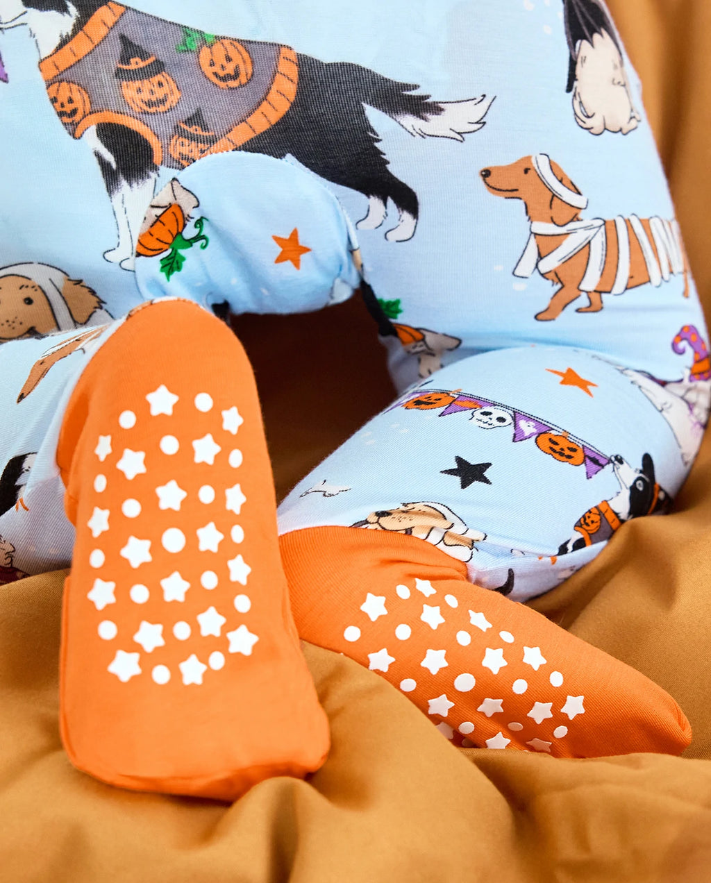 Close-up of orange foot grips on Spooky Pups Bamboo Zippy