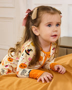Baby wearing Spooky Sweet Bamboo Zippy with soft Halloween print and comfortable stretch fit