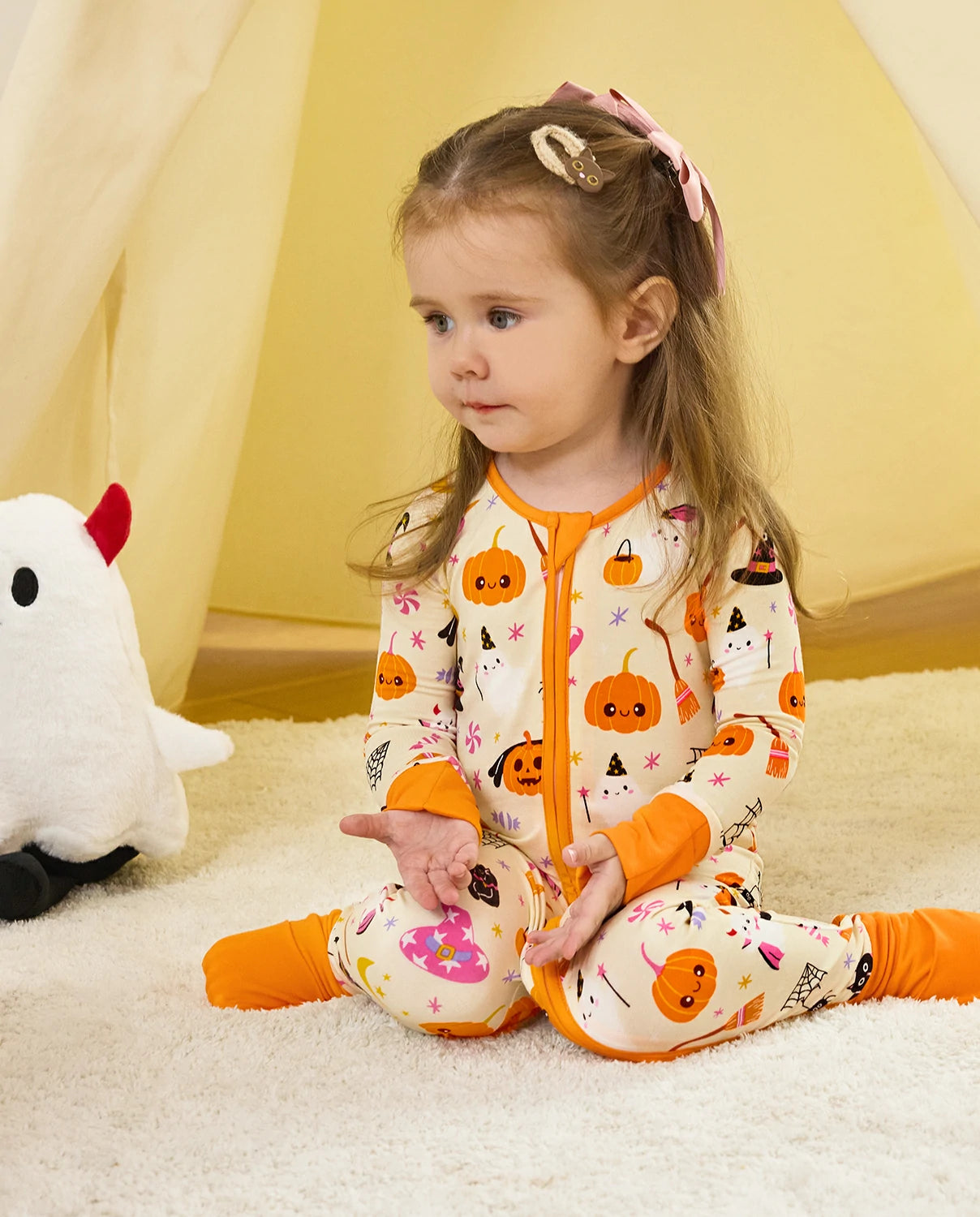 Spooky Sweet Bamboo Zippy Halloween pajamas in cozy indoor play setting