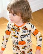Trick Trucks Long Two-Piece Pajama Set - child wearing the pajamas while standing, three-quarter view
