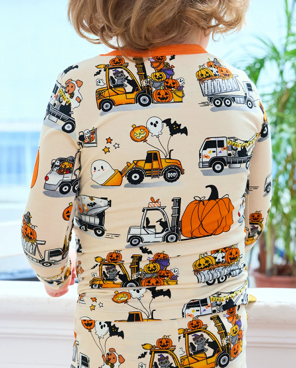 Trick Trucks Long Two-Piece Pajama Set - child wearing the pajamas, back view of the top and pants