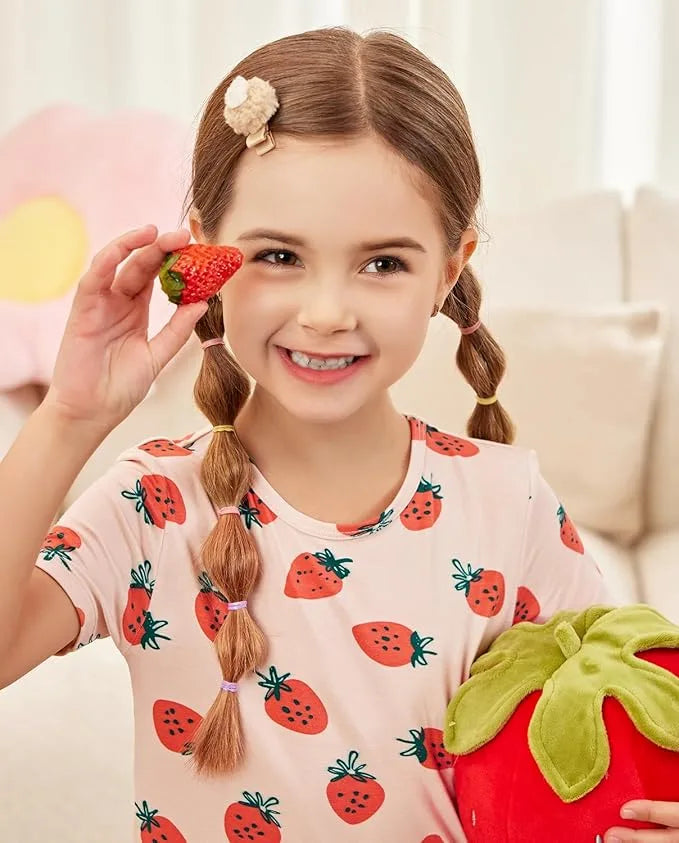 Child wearing Babee Reshinee strawberry bamboo pajamas
